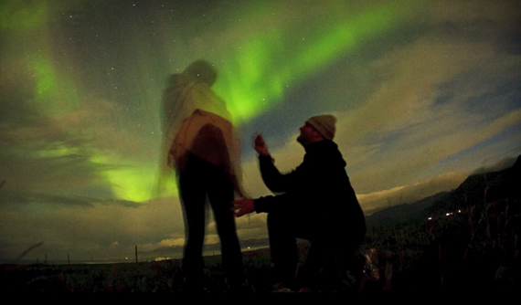 proposing against the aurora borealis nightsky