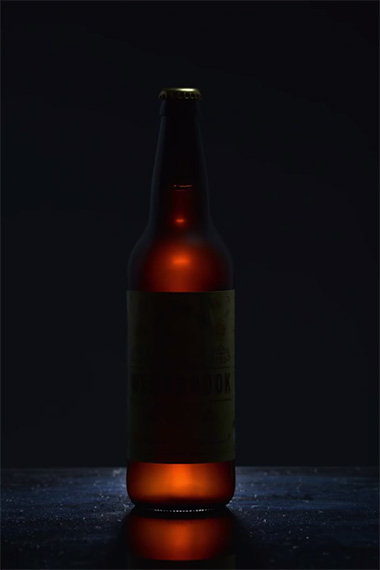 lighting top of beer bottle