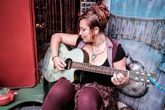 woman playing guitar