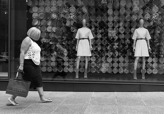 woman in front of store front street photo