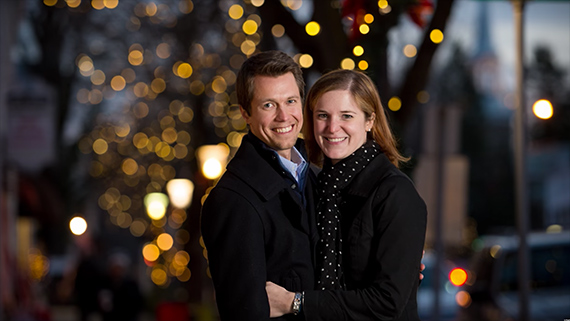 couple photographed with LED christmas lights