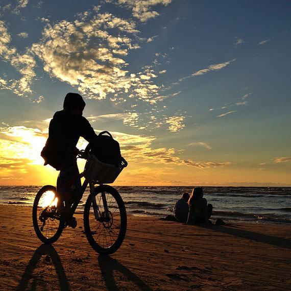 cyclist on the beach silhouette