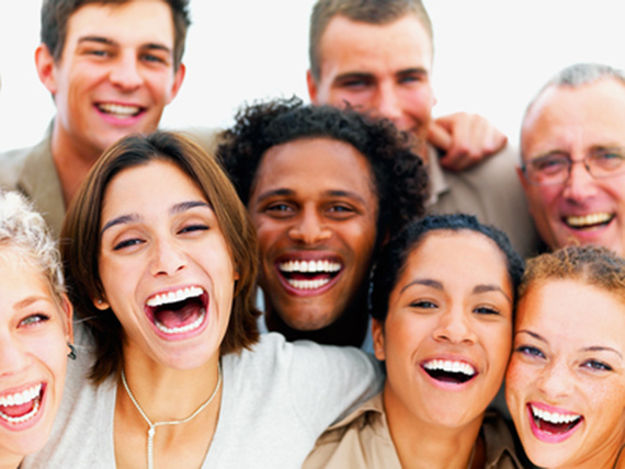 "Closeup portrait of a group of business people laughing" captured by Richard Foster