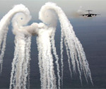 Interesting Photo of the Day: C-17 Wingtip Vortices Through Countermeasures