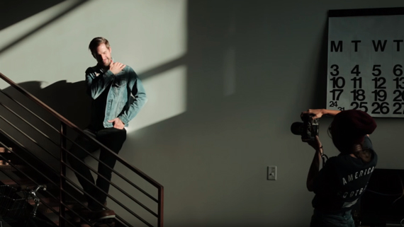 male model posing on stairs