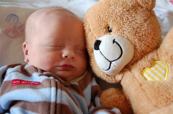 baby with stuffed toy