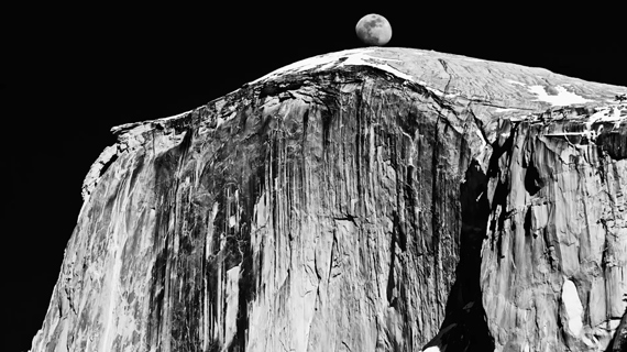 moon rising over a mountain