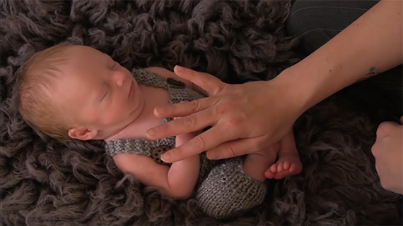 posing a newborn