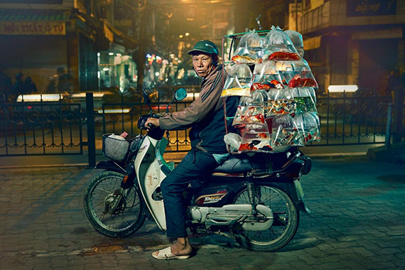 portrait of a man on bike in hanoi